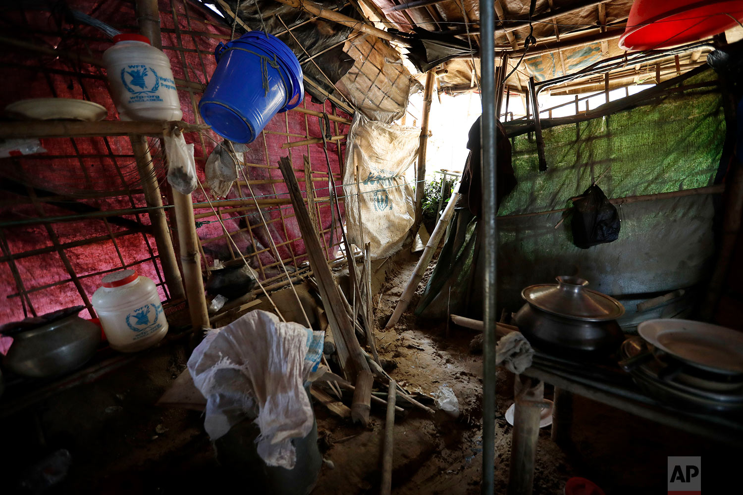  In this Wednesday, June 27, 2018, photo, the home of Abu Bakker, destroyed by a landslide, is seen in Chakmarkul refugee camp in Bangladesh. (AP Photo/Wong Maye-E) 