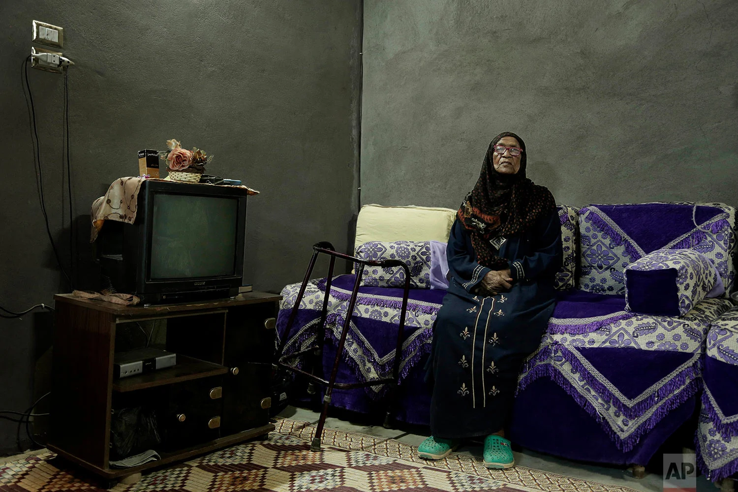 85-year-old grandmother Naemah Hussein sits in her home "tahgeer" Eneiba village, northern Aswan, Egypt. (AP Photo/Nariman El-Mofty)