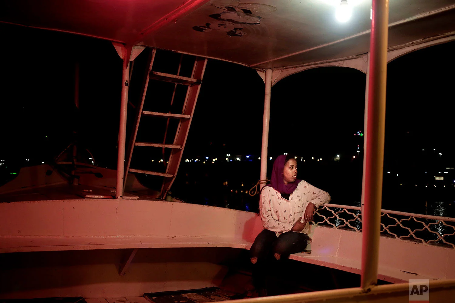30-year old Nubian activist Siham Othman, sits on a felucca on the Nile River in Aswan, Egypt. (AP Photo/Nariman El-Mofty)
