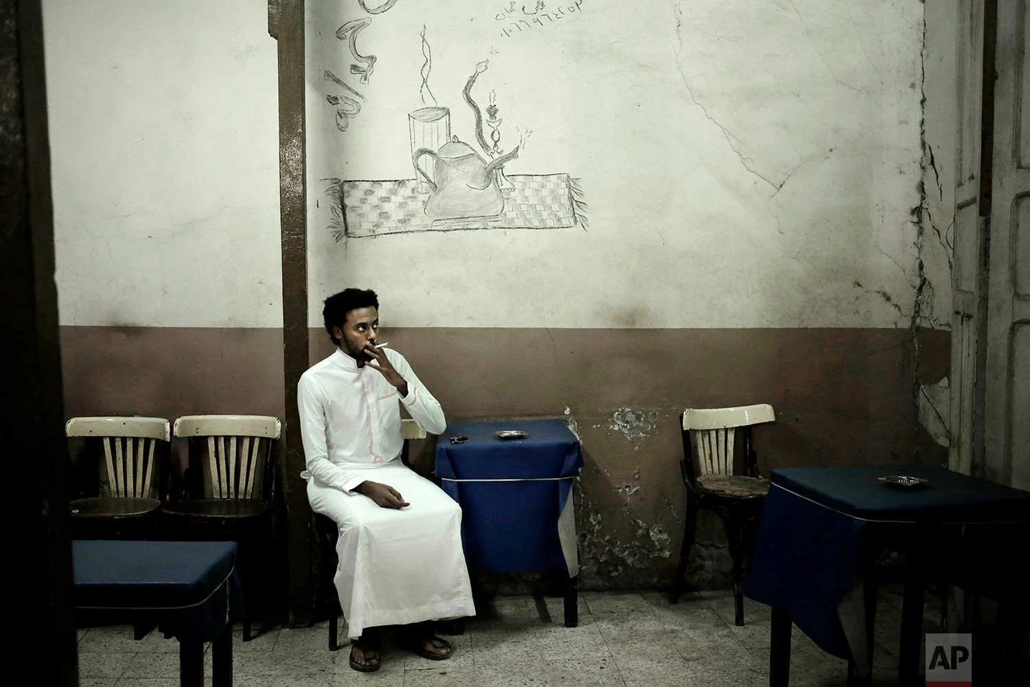 30-year old Nubian activist Mazen Alaa from the Fajeky tribe smokes a cigarette at a local cafe, in Aswan, Egypt. (AP Photo/Nariman El-Mofty)