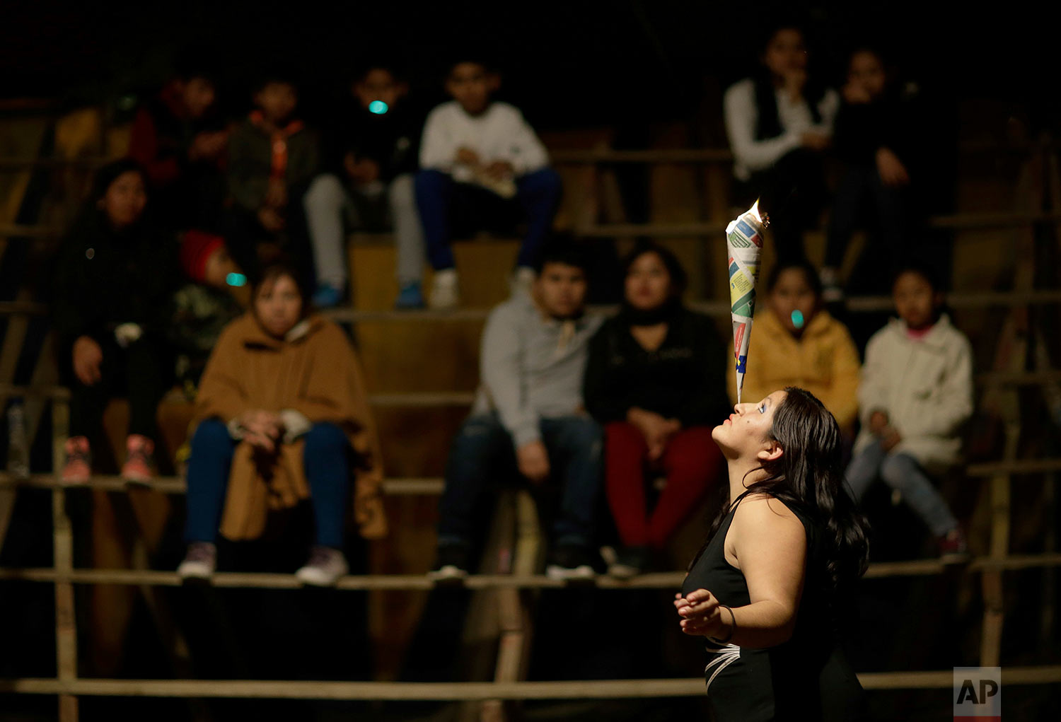  Catherine Barboza performs a balancing act before a few spectators inside the Tony Perejil circus tent set up in the shantytown of Puente Piedra on the outskirts of Lima, Peru, July 8, 2018. (AP Photo/Martin Mejia) 