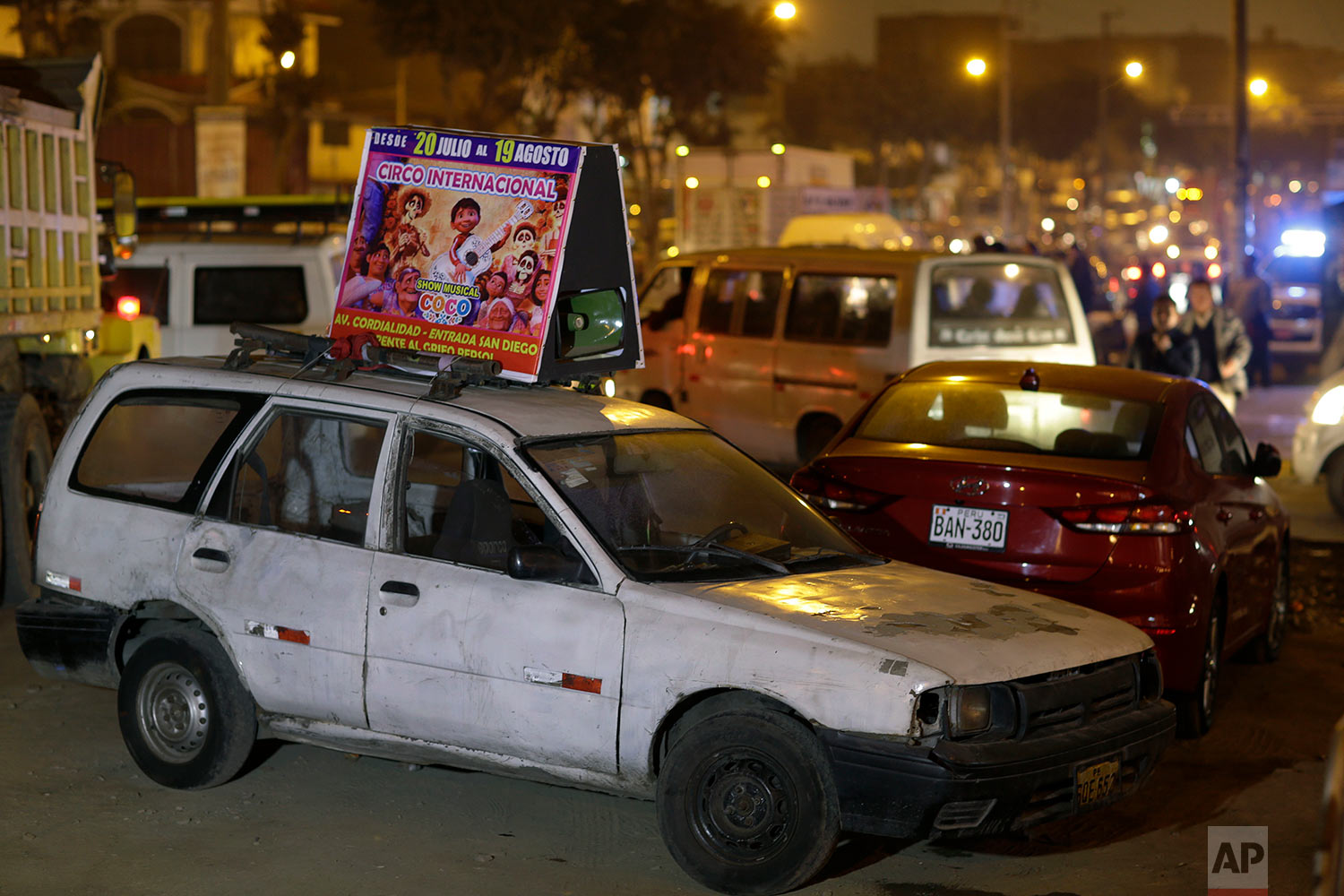  A sign advertising the International Circus sits on a car parked on a main road in the shantytown Pro on the outskirts of Lima, Peru, July 20, 2018. (AP Photo/Martin Mejia) 