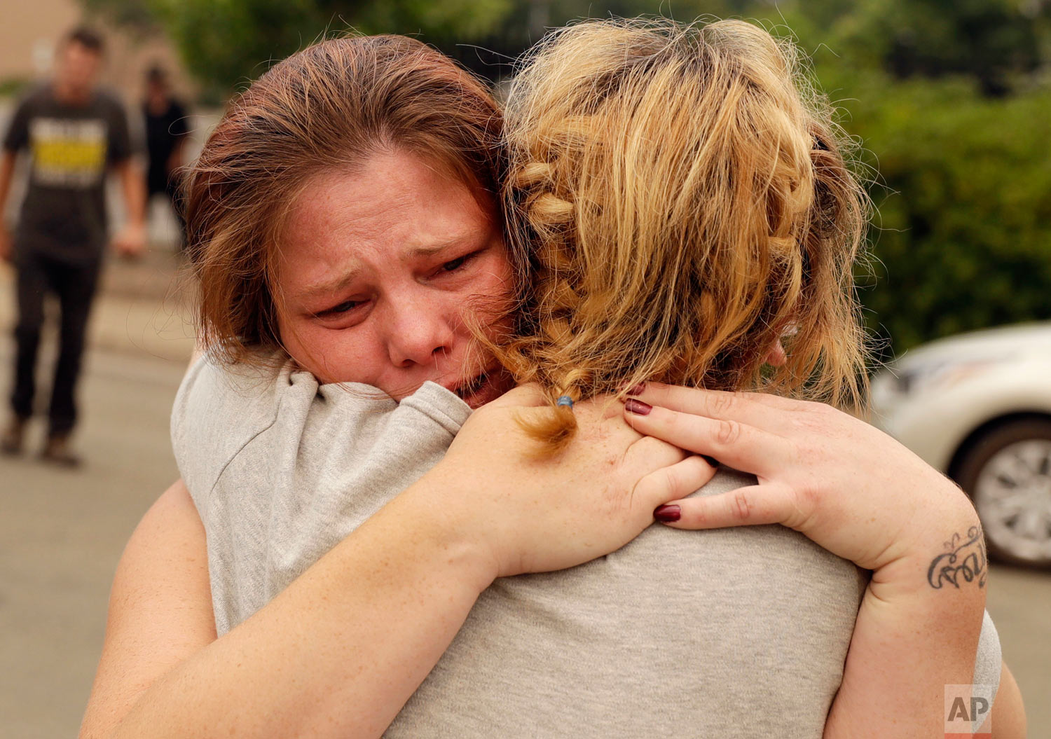  Carla Bledsoe, facing camera, hugs her sister, Sherry, outside of the sheriff's office in Redding, Calif., on Saturday, July 28, 2018, after hearing news that Sherry's children, James and Emily, and her grandmother, Melody Bledsoe, were killed in a 