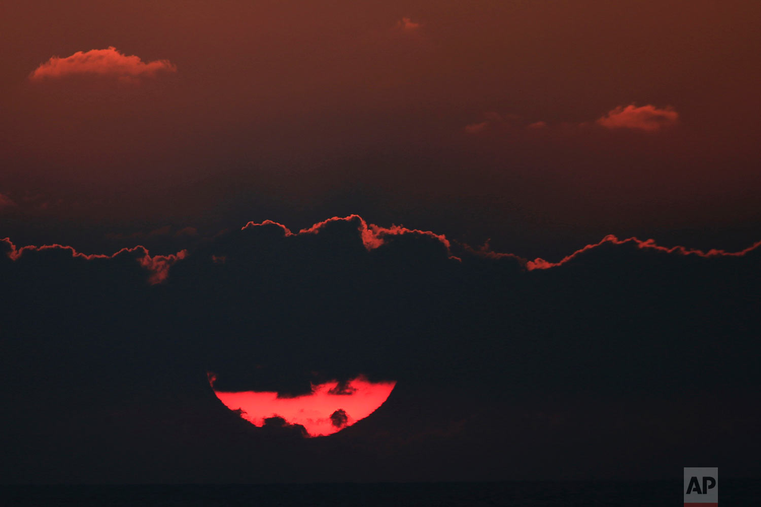  The sun sets over the Mediterranean Sea off the coast of Ashdod, Israel, Sunday, July 29, 2018. (AP Photo/Ariel Schalit) 