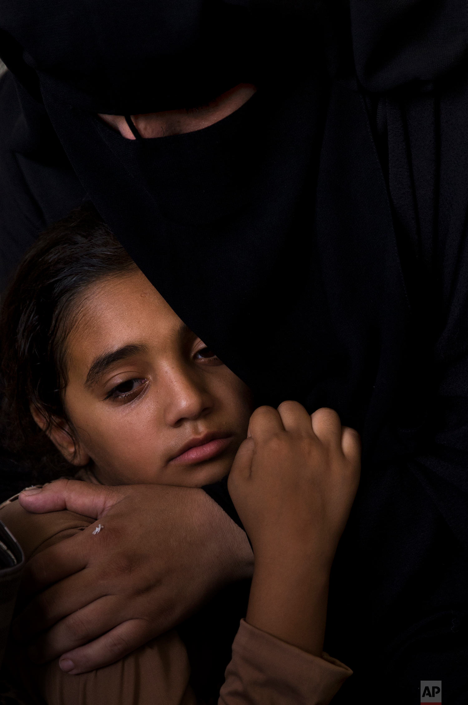  Palestinian relatives of 11 year-old boy, Majdi al-Satari, who was shot and killed by Israeli troops on Friday's ongoing protest at the Gaza Strip's border with Israel, mourn at the family home during his funeral in town of Rafah, Southern Gaza Stri