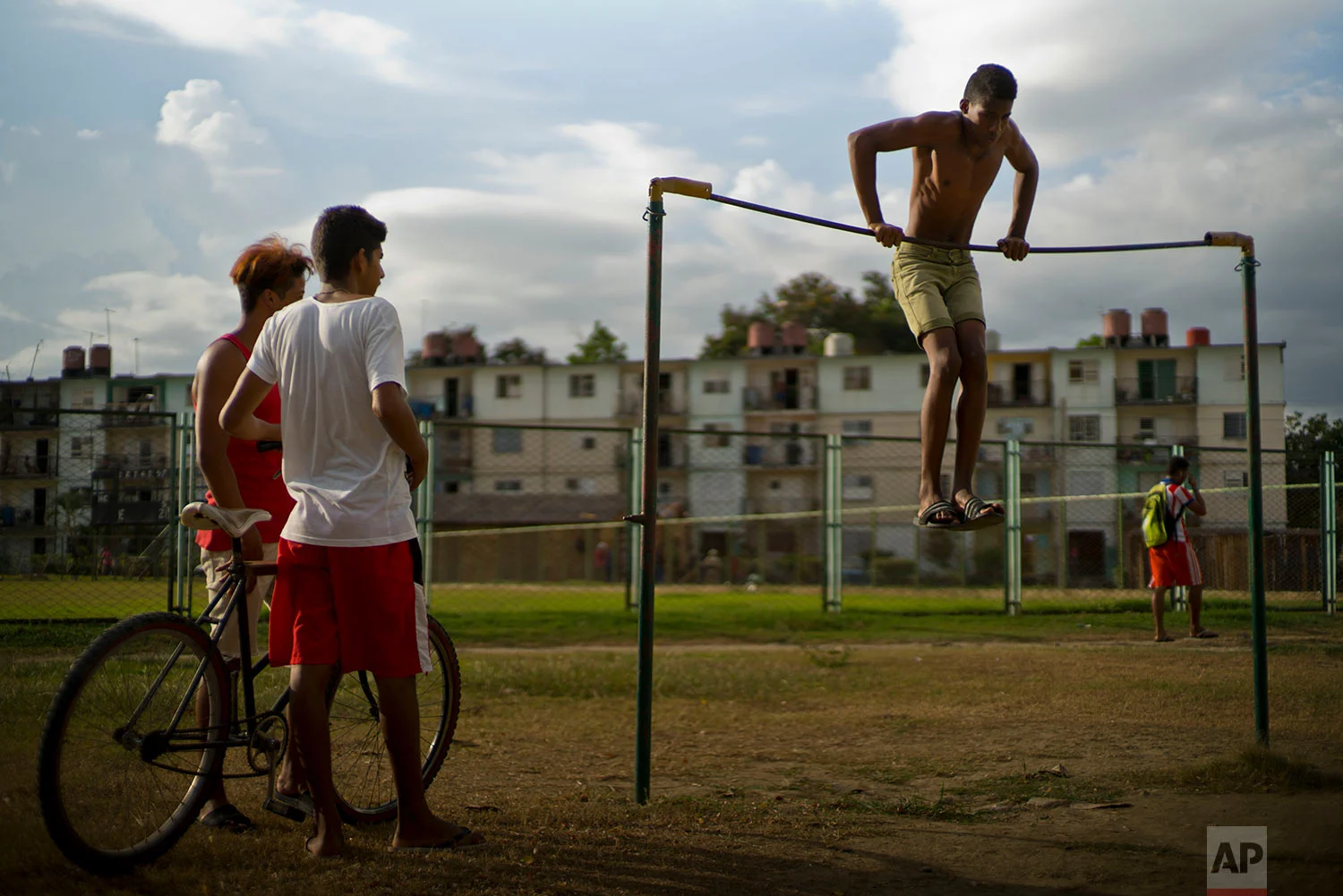 A youth works out on an exercise bar at a park by Plaza de la Revolucion in Guantanamo, Cuba, July 24, 2018.