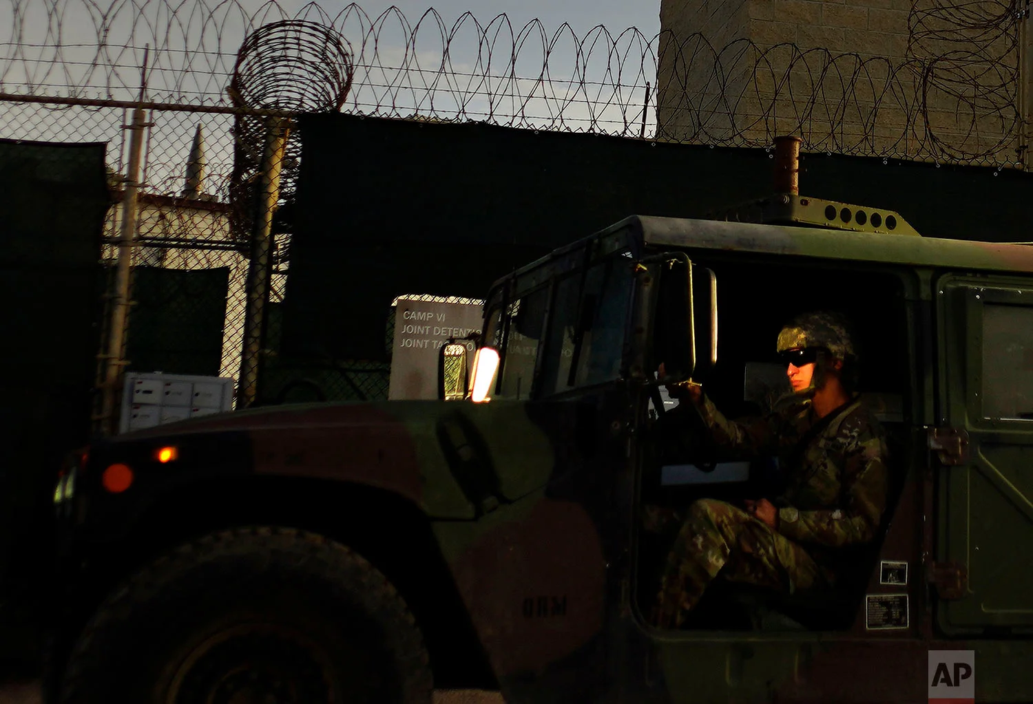 A U.S. solider drives a military vehicle past Camp VI at the naval base at Guantanamo Bay, June 5, 2018.