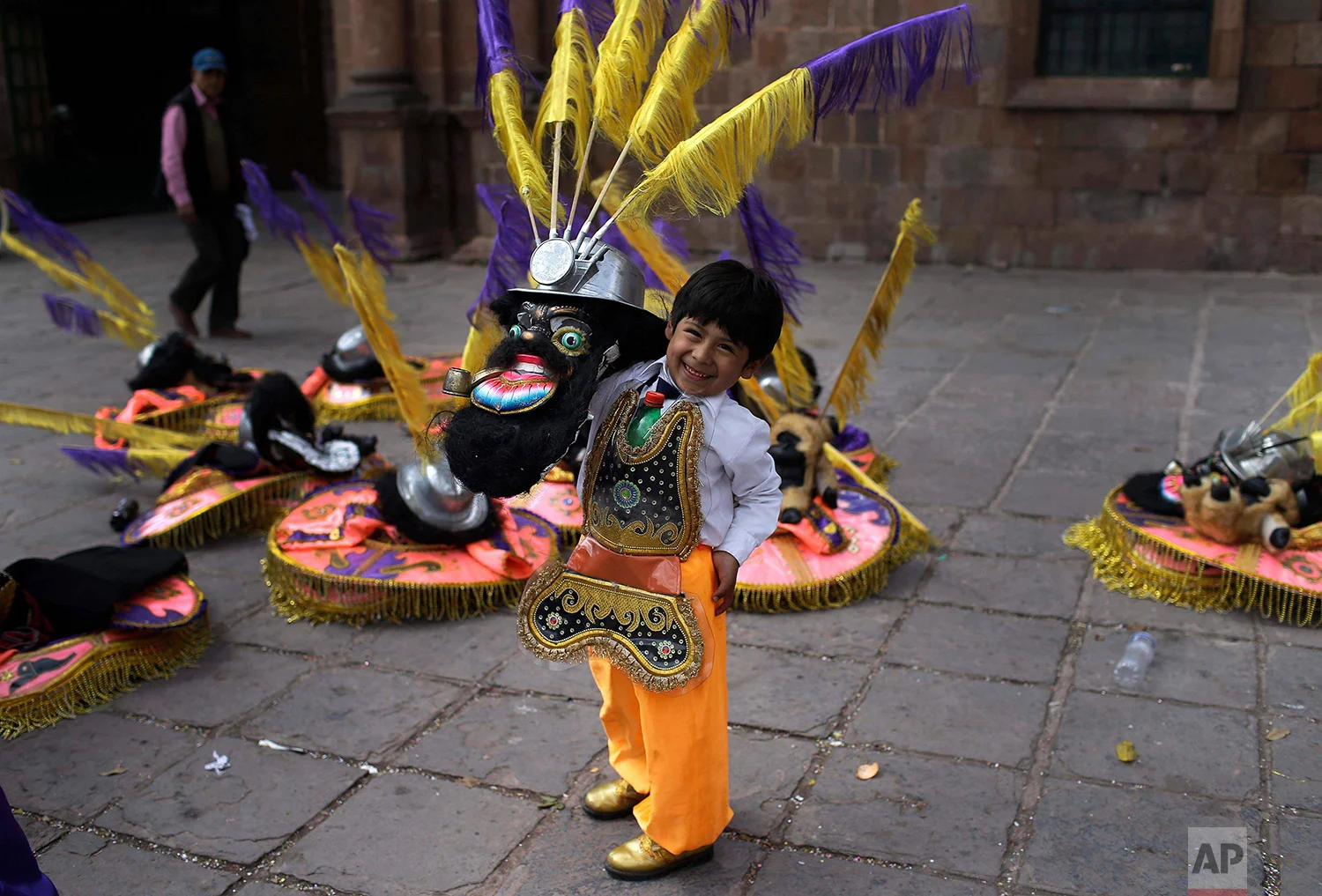  Eight-year-old Miguel smiles while posing in his "rey moreno" or “black king” dance costume before the start of a procession honoring Our Lady of Copacabana, in Cuzco, Peru, Aug. 5, 2018. (AP Photo/Martin Mejia) 
