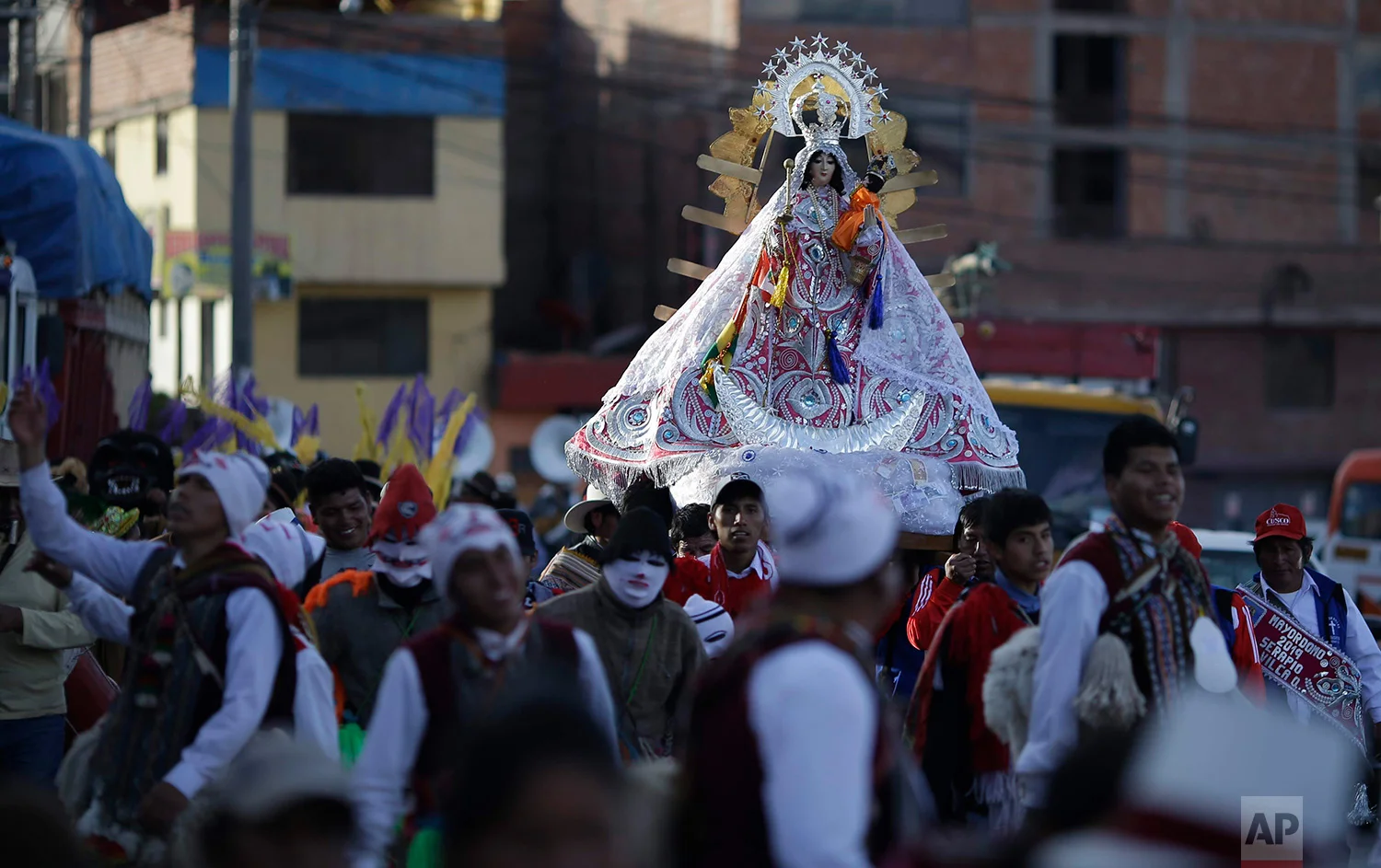  Devotees take part in a religious procession honoring Our Lady of Copacabana, in Cuzco, Peru, Aug. 5, 2018. The veneration of Bolivia’s patron saint in Cuzco began a decade ago with a small feast among friends and family.  (AP Photo/Martin Mejia) 