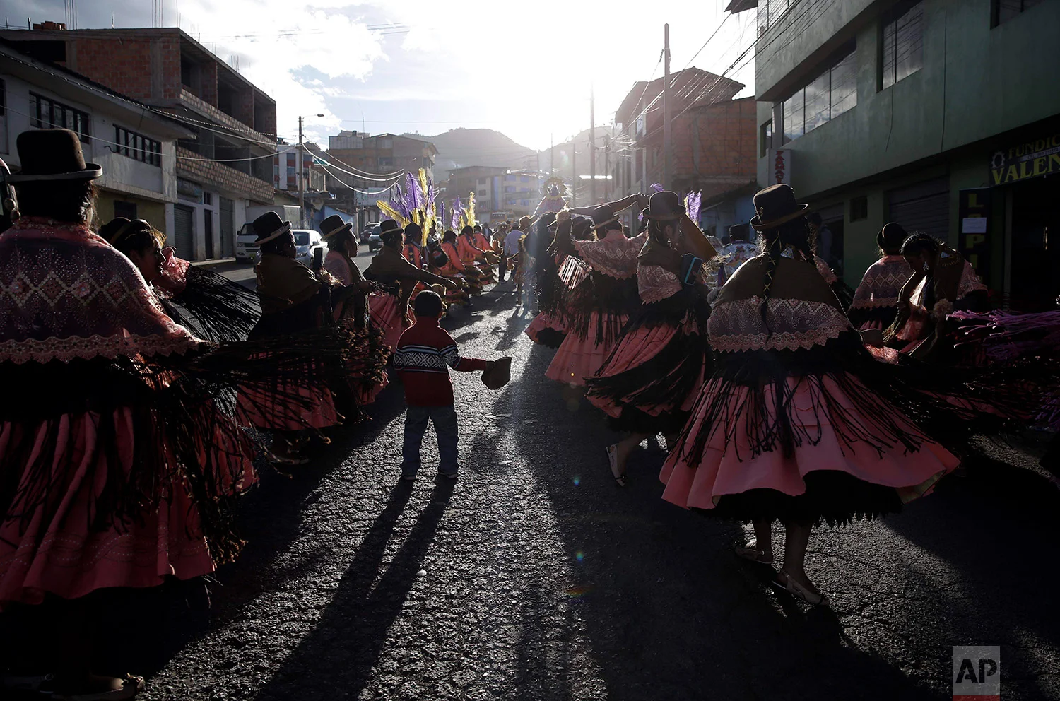  Dance troupes perform the "Morenada" or Dance of the Black Slaves, during celebrations honoring Our Lady of Copacabana, in Cuzco, Peru, Aug. 5, 2018. The traditional Bolivian dance is comprised of a synergistic mix of African and Aymara influences. 