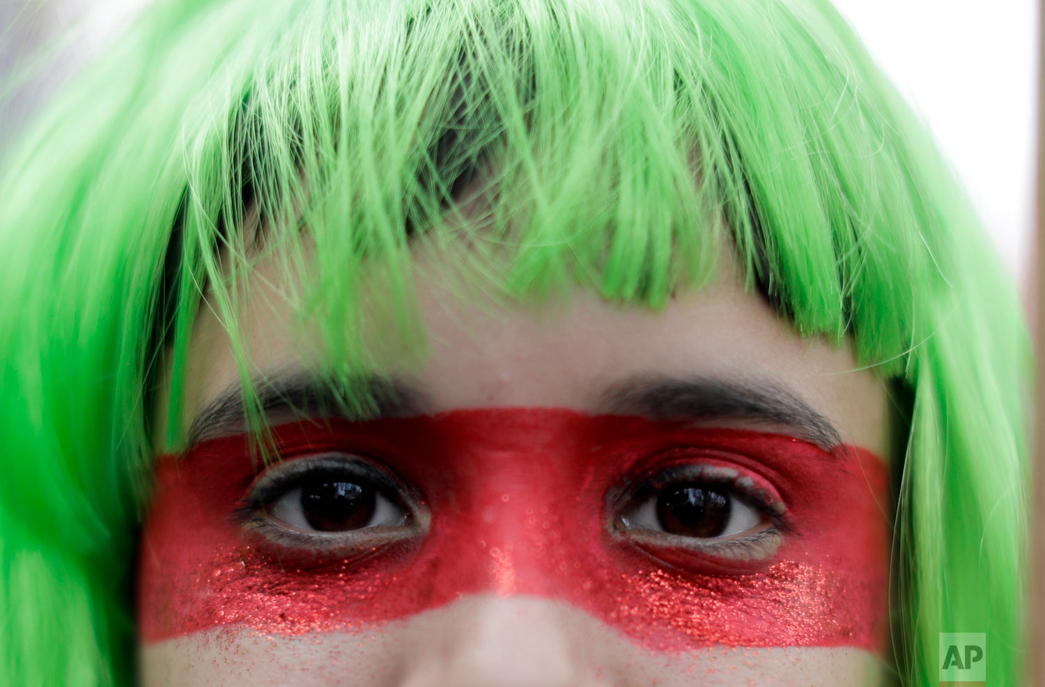  A demonstrator in support of decriminalizing abortion stands outside the congress building in Buenos Aires, Argentina, Wednesday, Aug. 8, 2018. Following months of increasingly tense debate, lawmakers in Argentina met on Wednesday ahead of a vote on