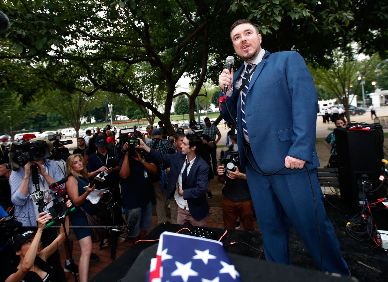  White nationalist Jason Kessler talks during a rally near the White House on the one year anniversary of the Charlottesville "Unite the Right" rally, Sunday, Aug. 12, 2018, in Washington. (AP Photo/Alex Brandon) 