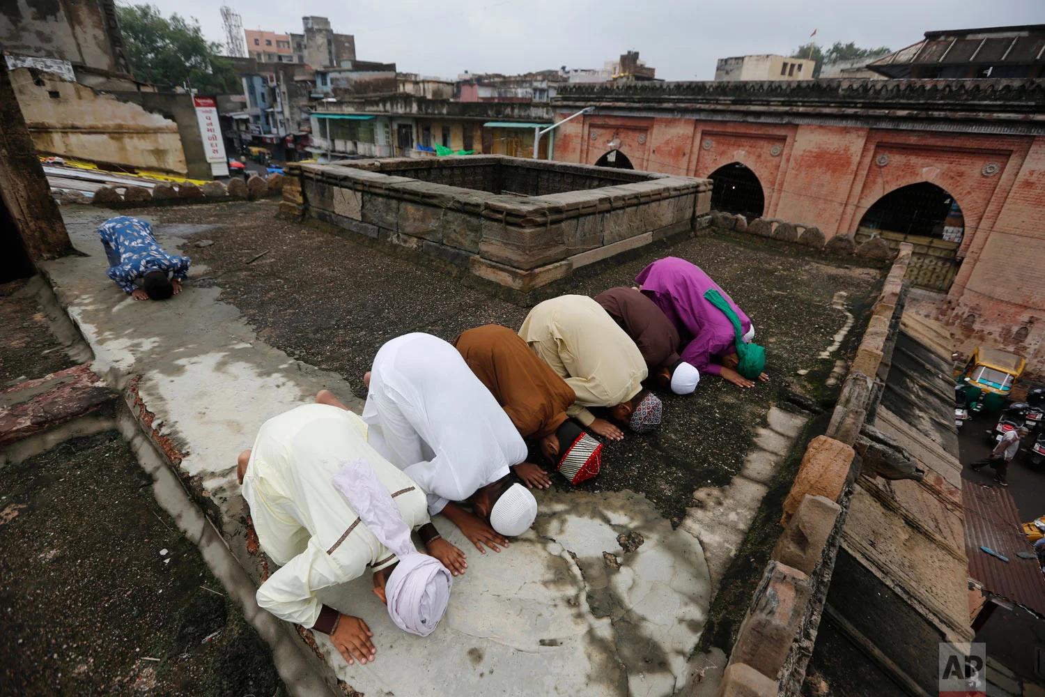 Muslims offer Eid al-Adha prayers at Jama Mosque in Ahmadabad, India, Wednesday, Aug. 22, 2018. Muslims around the world celebrate Eid al-Adha, or the Feast of the Sacrifice, by sacrificing animals to commemorate the prophet Ibrahim's faith in being willing to sacrifice his son. (AP Photo/Ajit Solanki)