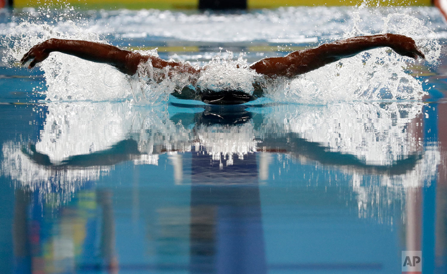 India's Sajan Prakash swims in his heat of the men's 100m butterfly during the swimming competition at the 18th Asian Games in Jakarta, Indonesia, Wednesday, Aug. 22, 2018. (AP Photo/Lee Jin-man)