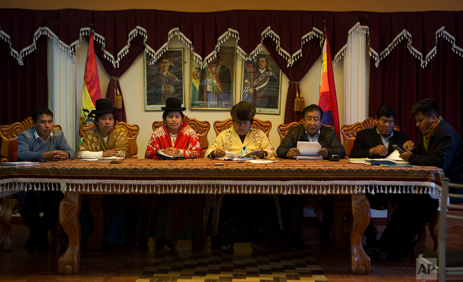  In this July 25, 2018 photo, Batallas Councilwoman Lidia Maria Quispe, from second left, Council Vice President Sonia Alanoca Tito and Council President Rosa Condori Cadena, attend a council meeting in Batallas, Bolivia. (AP Photo/Juan Karita) 