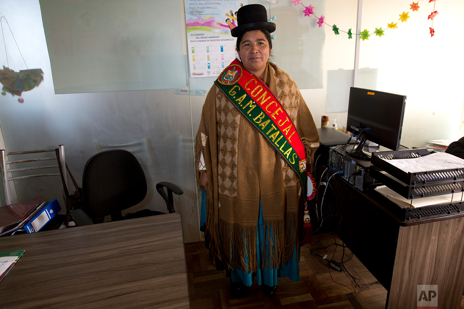  In this July 25, 2018 photo, Batallas Councilwoman Lidia Maria Quispe, poses for photo wearing her official sash, in Batallas, Bolivia. (AP Photo/Juan Karita) 
