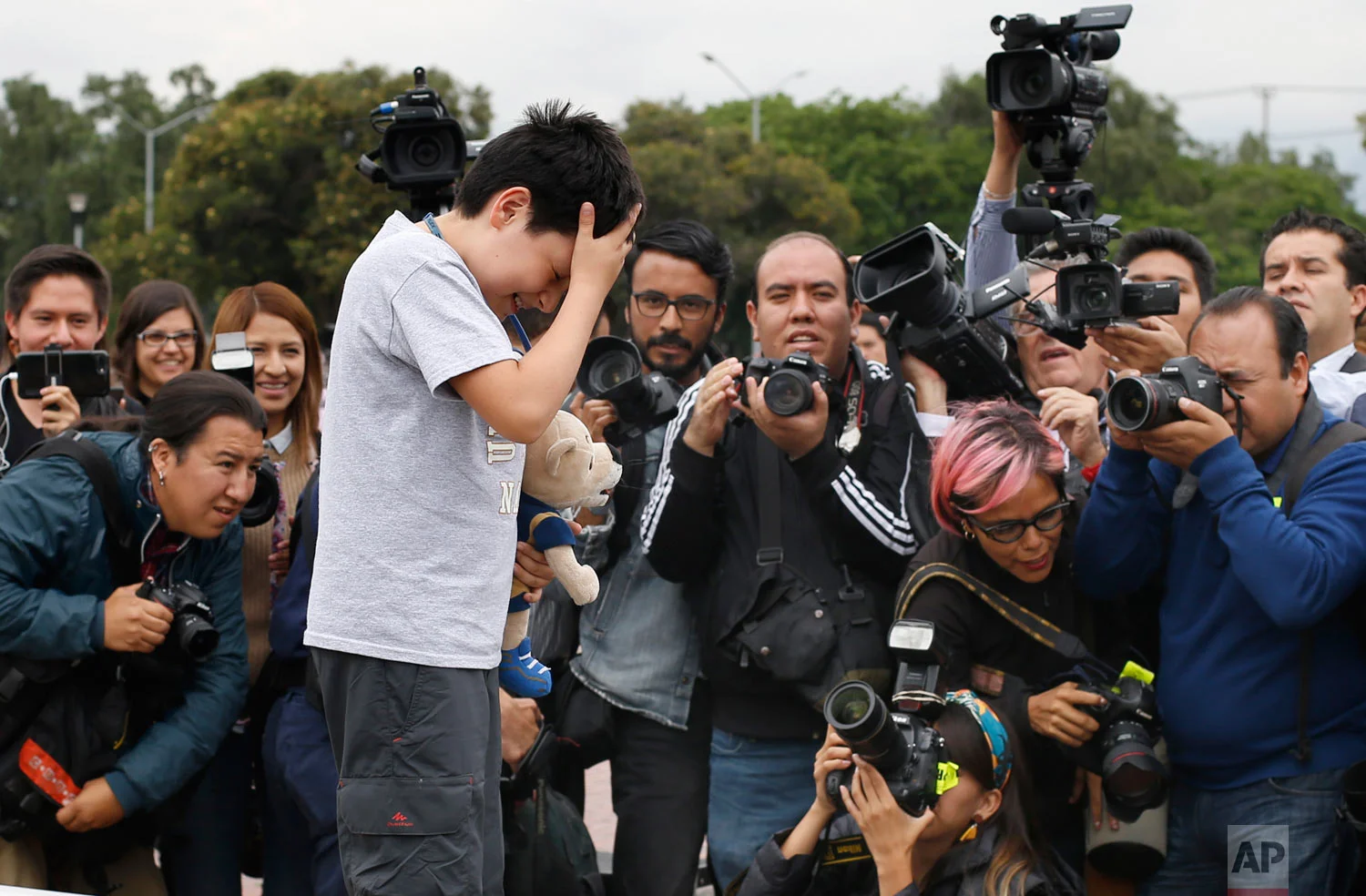 12-year-old Carlos Santamaria Diaz poses for photographers during a press event at Mexico's National Autonomous University in Mexico City, Friday, Aug. 3, 2018. The university, better known by its Spanish initials as the UNAM, said Thursday that Carlos Santamaria Diaz is the youngest such student in the university's roughly century-long history.(AP Photo / Marco Ugarte)