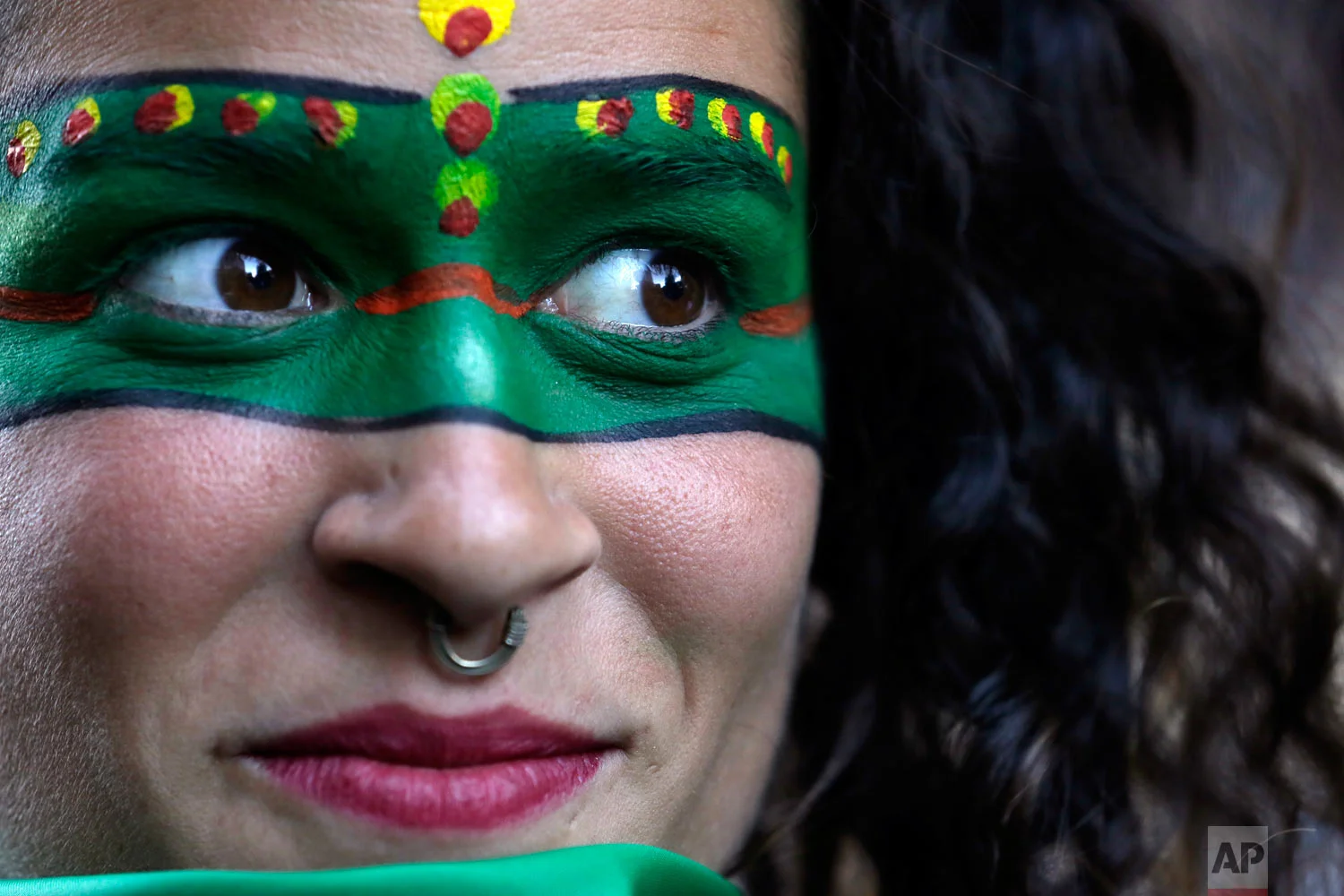 A woman attends a demonstration in support of decriminalizing abortion, outside the Argentine embassy in Quito, Ecuador, Aug. 8, 2018. Argentina's Senate is debating legislation that would legalize elective abortions in the first 14 months of pregnancy, an issue that bitterly divides the homeland of Pope Francis. (AP Photo/Dolores Ochoa)