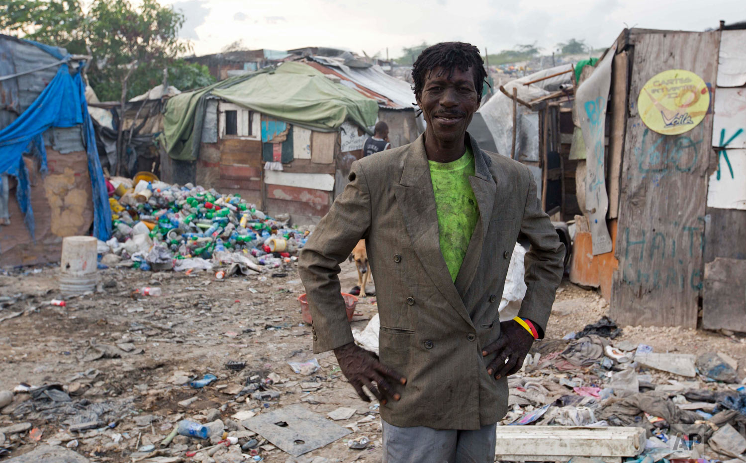  Wilfrid Jocelyn, 52, poses for a portrait near his home on the edge of the landfill. (AP Photo/Dieu Nalio Chery) 