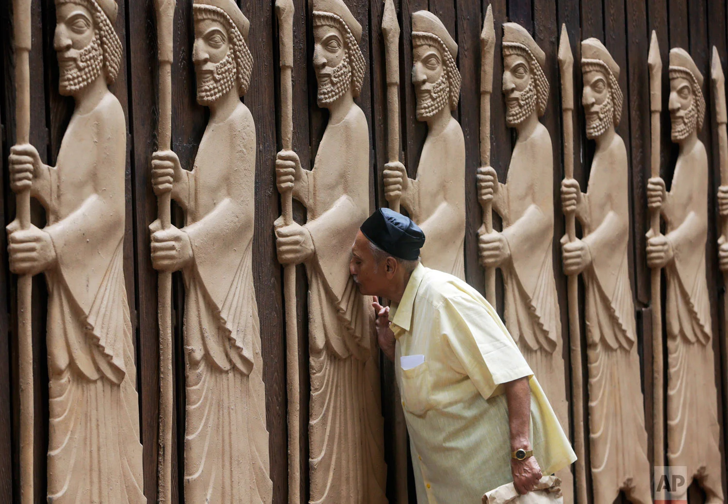 A Parsi offers prayers on their New Year in Mumbai, India, Friday, Aug. 17, 2018. (AP Photo/Rajanish Kakade)