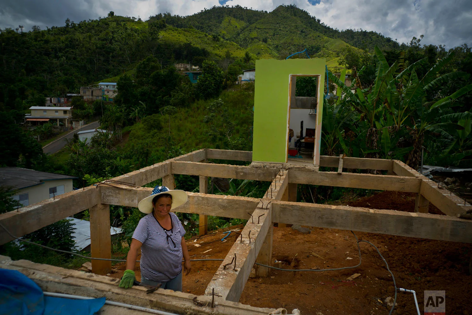 Alma Morales Rosario stands in her home that is being rebuilt. Sept. 8, 2018. (AP Photo/Ramon Espinosa)