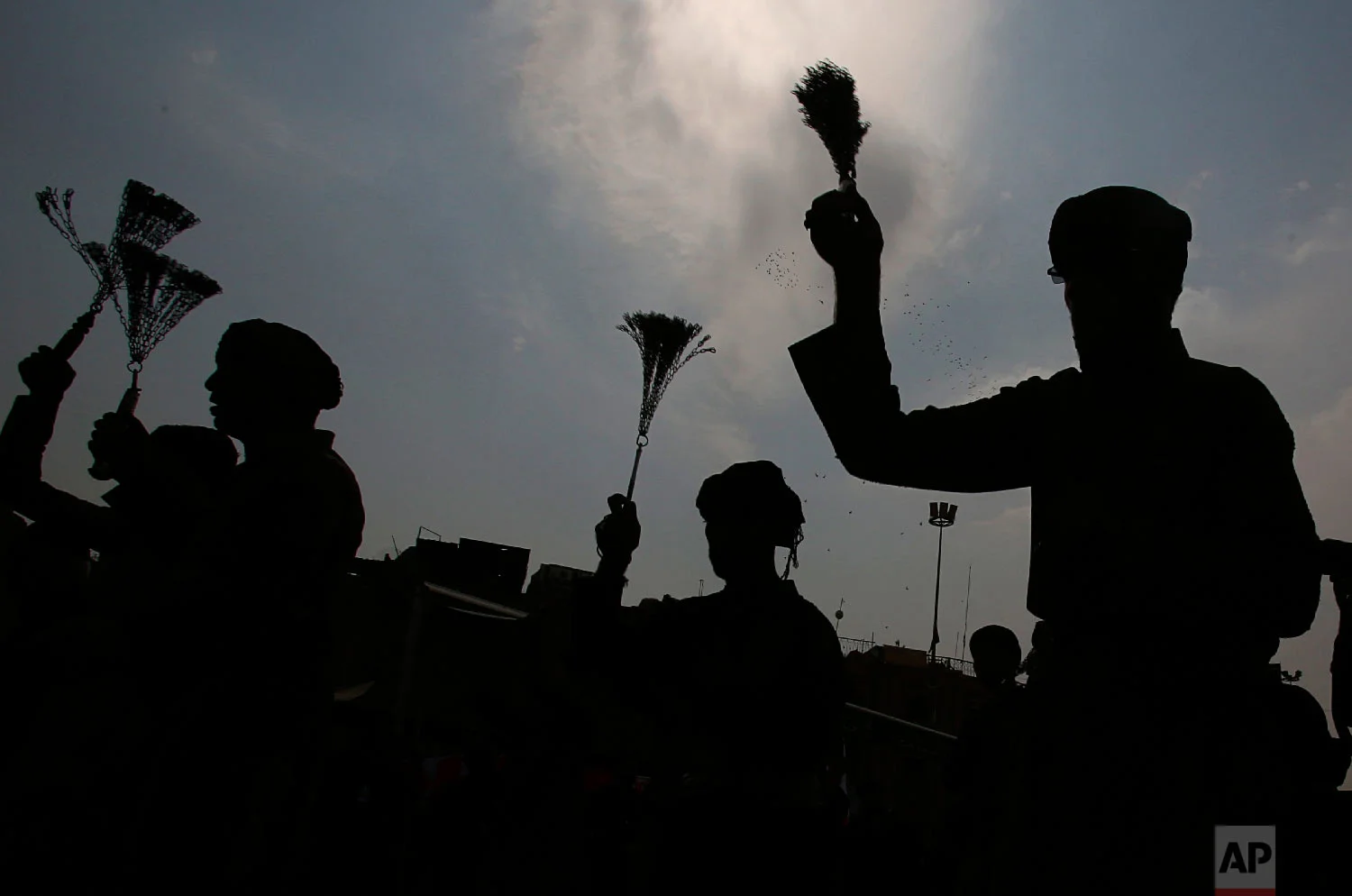 Shiite faithful pilgrims beat themselves with chains as a sign of grief for Imam Hussein during the Muslim month of Muharram, in Karbala south of Baghdad, Iraq, Sept. 19, 2018. (AP Photo/Karim Kadim)