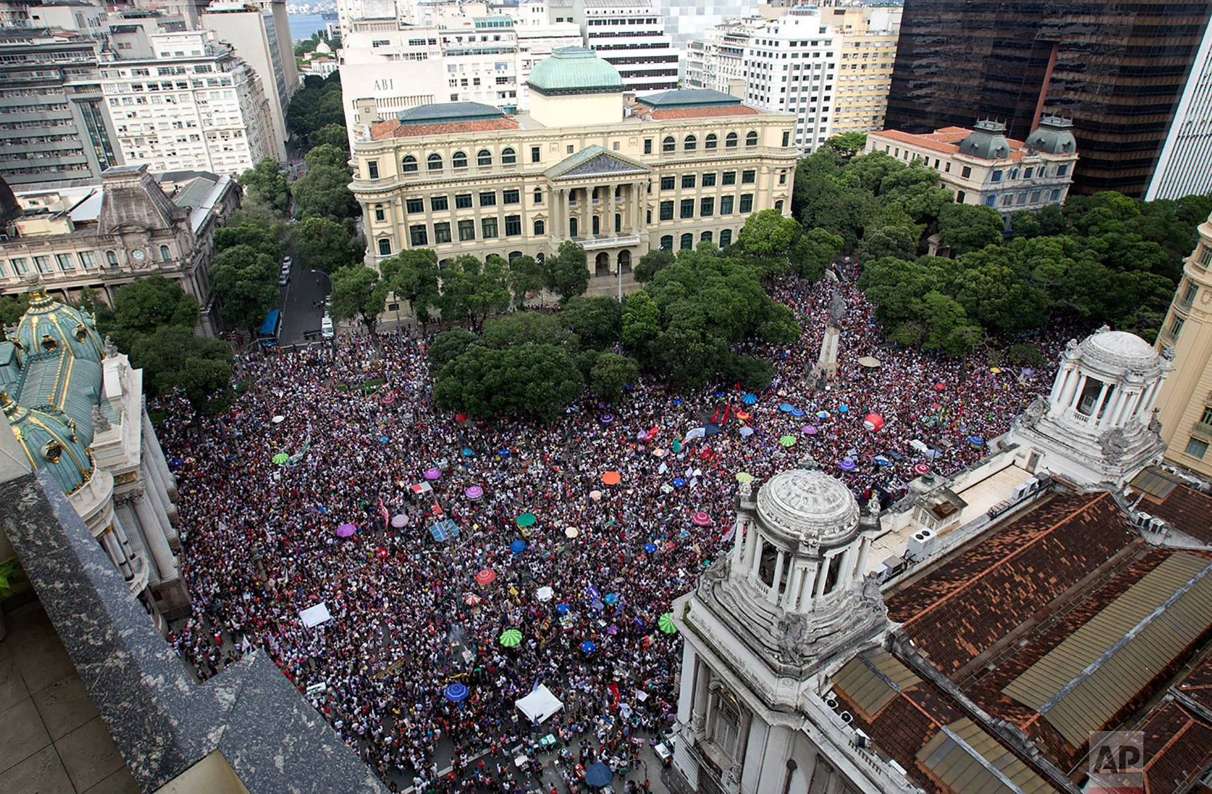 People protest against leading presidential candidate Jair Bolsonaro, at Cinelandia Square in Rio de Janeiro, Brazil, Sept. 29, 2018. Bolsonaro has long been known for offensive comments about gays, women and black people, and he hasn't tempered his rhetoric during the campaign. He has also kept up his praise of Brazil's two-decade military dictatorship and promised to give police permission to shoot first and ask questions later. (AP Photo/Silvia Izquierdo)