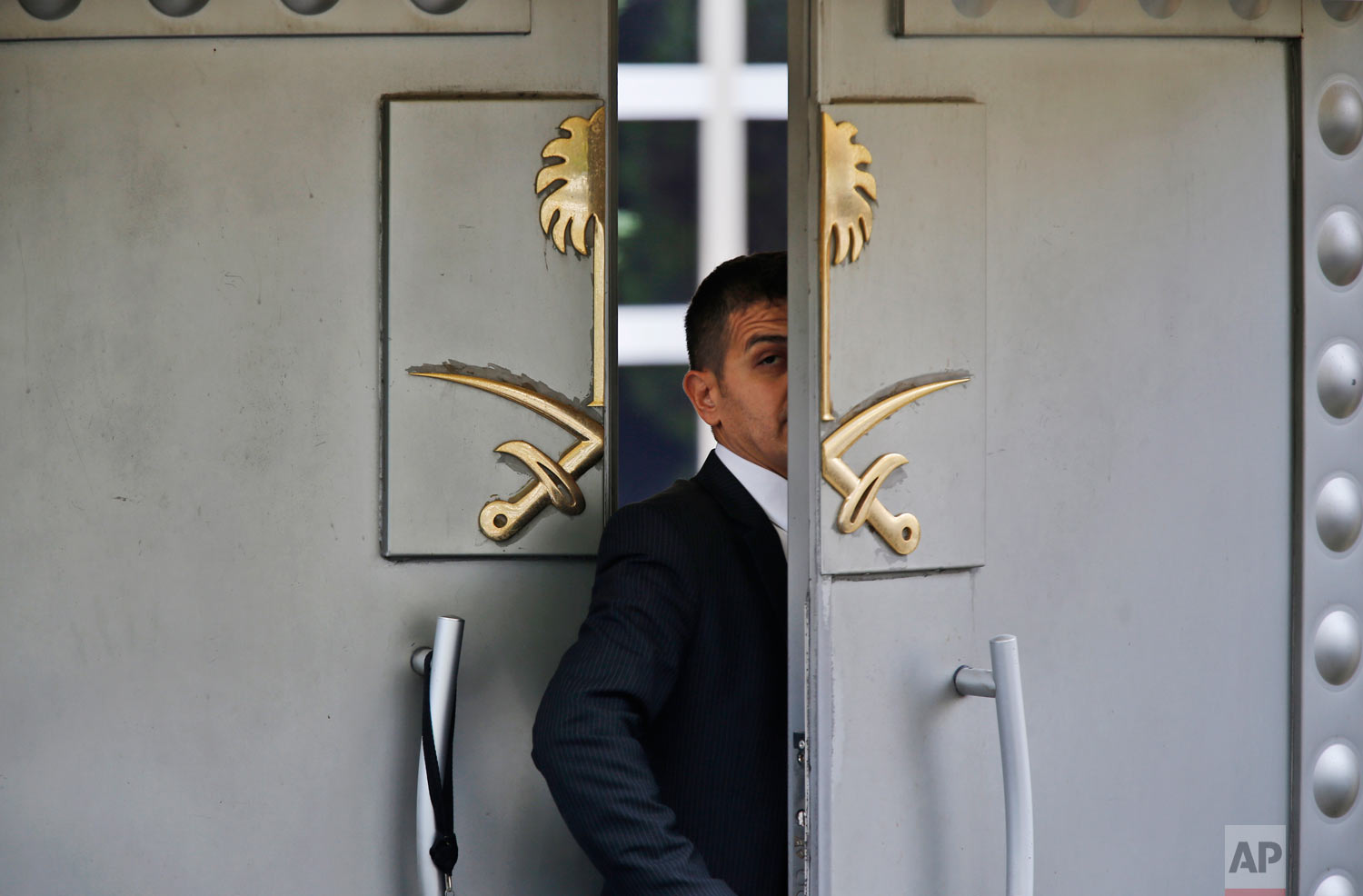 A security guard walks into the Saudi Arabian consulate in Istanbul, Turkey on Tuesday, Oct. 9, 2018. U.S. resident Jamal Khashoggi, a critic of the Saudi government, went missing more than a week ago after entering the consulate, and Turkish officials have said they believe he was murdered there. (AP Photo/Lefteris Pitarakis)
