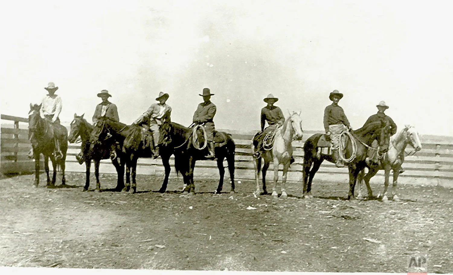 This around 1910 photo provided by Francine Locke Bray shows Victor M. Locke, Sr., center, with unknown cowboys on Choctaw horses in Pushmataha County, Okla. (Francine Locke Bray via AP)