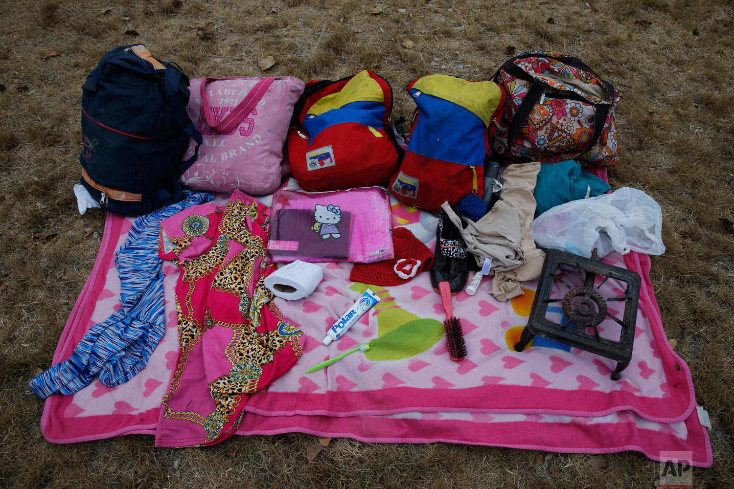  In this Sept. 7, 2018 photo, the belongings of Venezuelan mother Sandra Cadiz and her 10-year-old daughter Angelis, which they carried by foot on their journey from Venezuela to Peru, sit neatly displayed for a picture in Huaquillas, Ecuador. They c