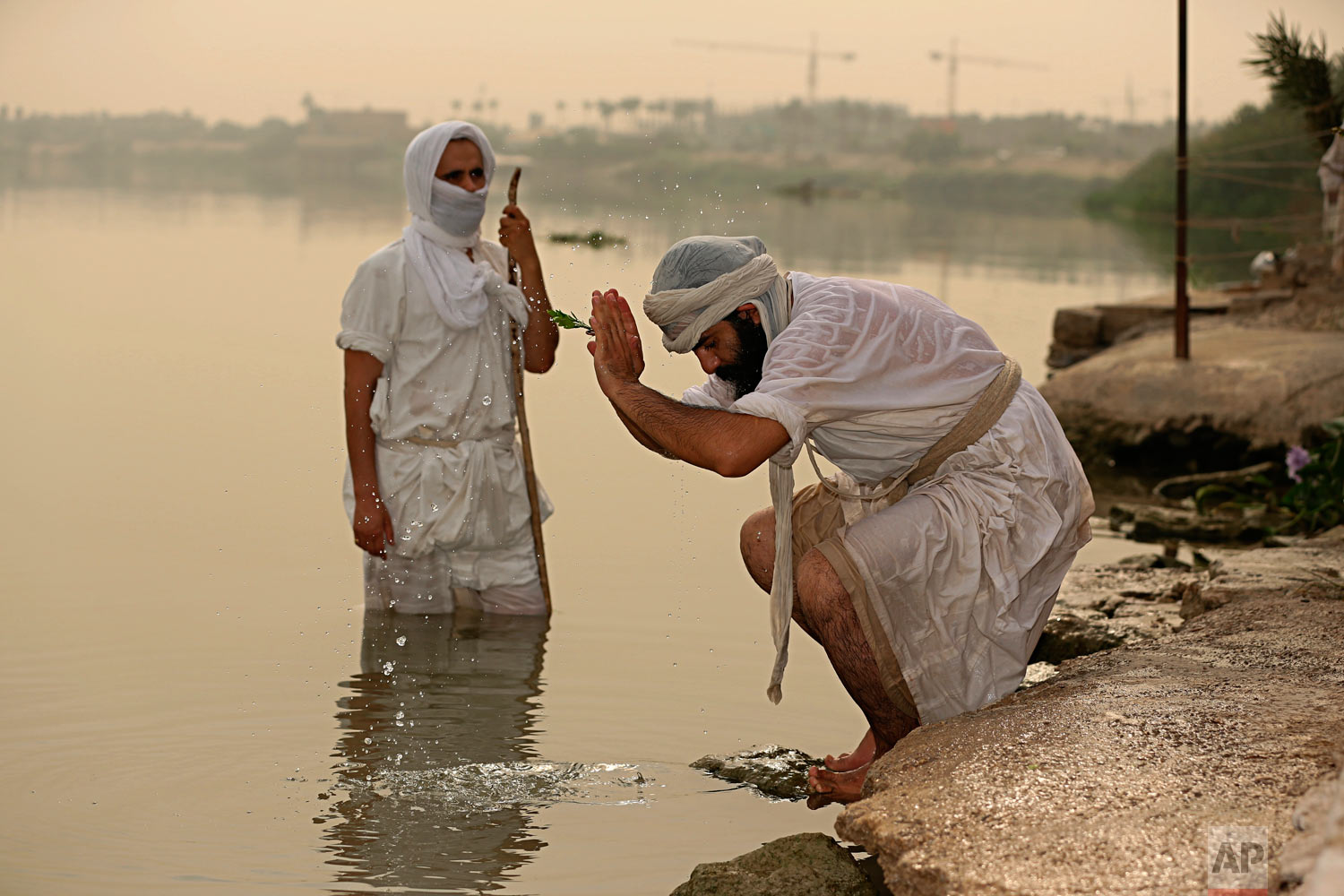  Followers of the ancient Mandaean religious sect perform their rituals along the strip of embankment of the Tigris River reserved for them, in Baghdad, Iraq, on Sunday, Oct. 14, 2018. Mandaeanism follows the teachings of John the Baptist, a saint in