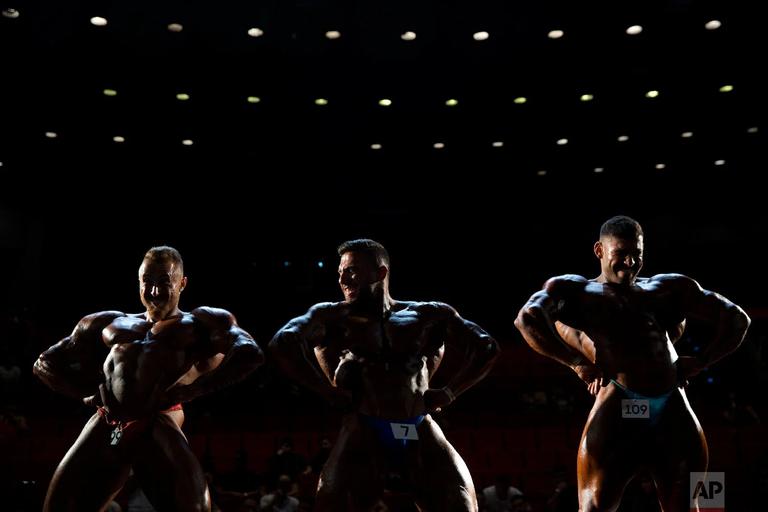 Contestants participate in the final round during the National Amateur Body Builders' Association competition in Tel Aviv, Israel on Oct. 18, 2018. (AP Photo/Oded Balilty)