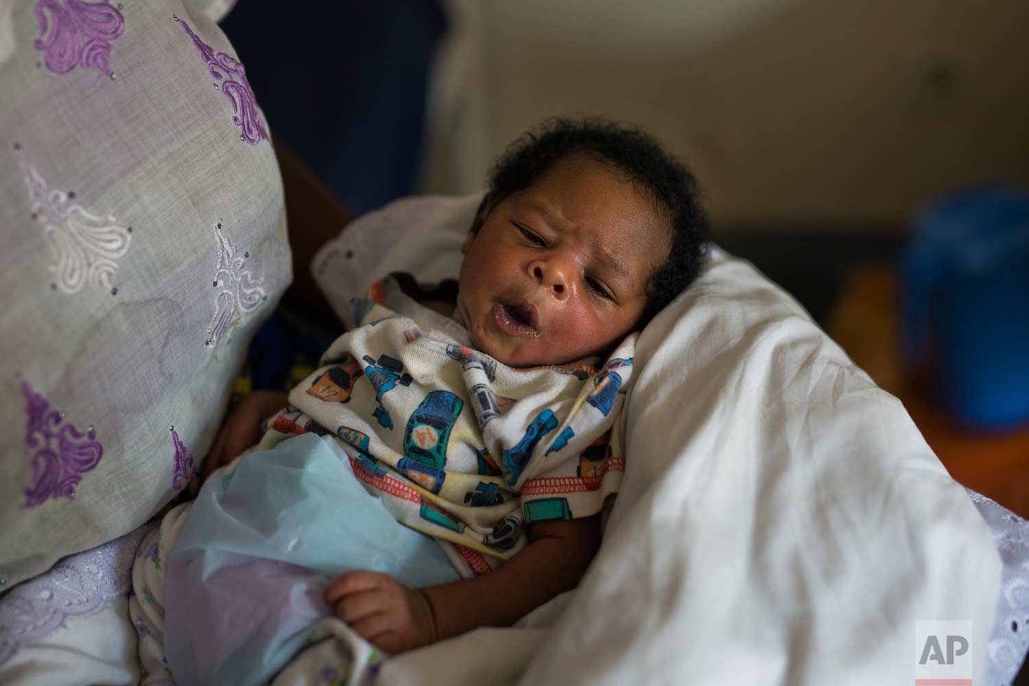  Alice Kabuya, 20, holds her week-old daughter at the Masaidizi Health Center in Lubumbashi, Democratic Republic of the Congo on Tuesday, Aug. 14, 2018. Kabuya is unable to pay the $150 medical bill and her jobless husband is trying to gather the fun