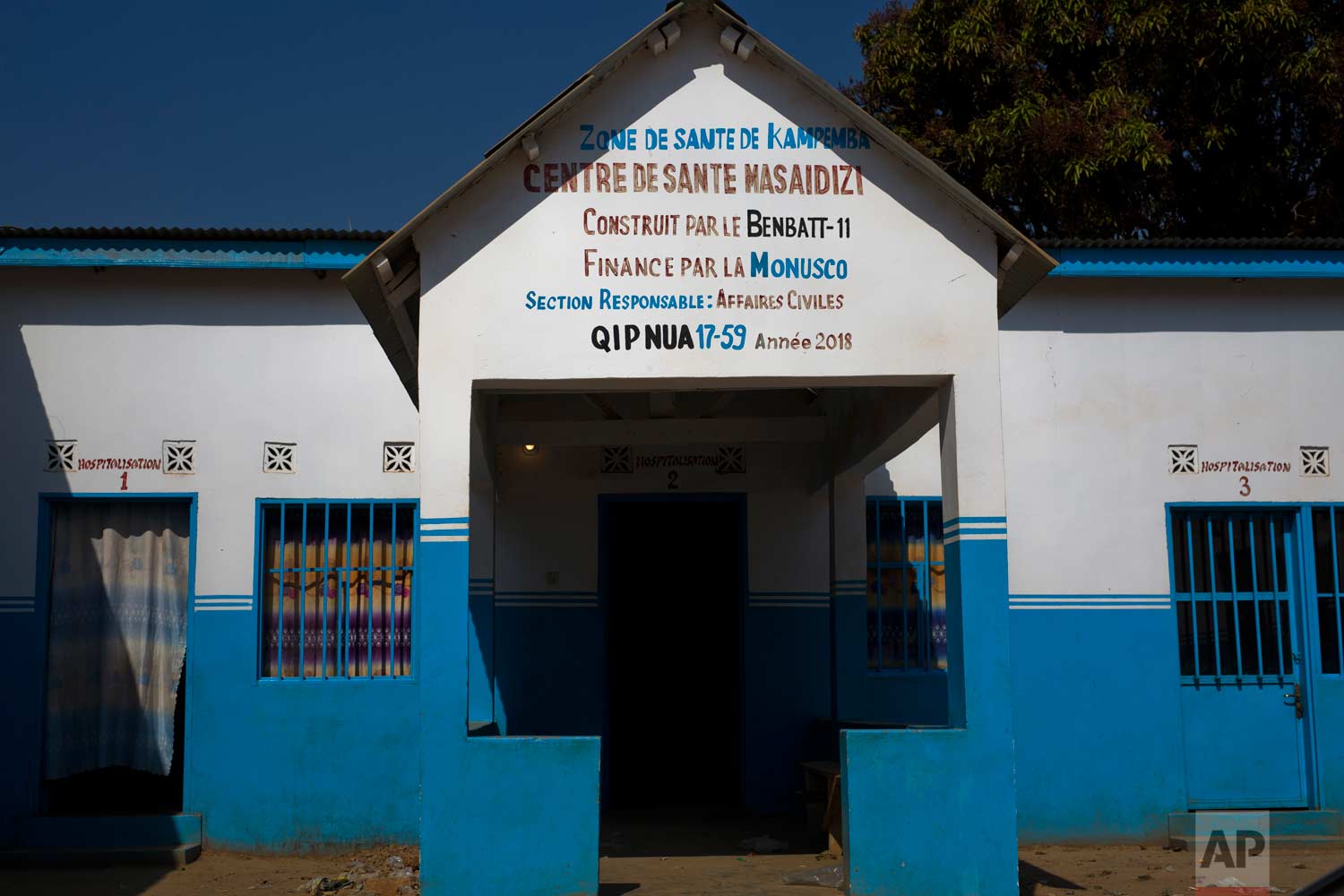  This Tuesday, Aug. 14, 2018 photo shows the entrance of the Masaidizi Health Center, which was recently built by the United Nations in Lubumbashi, Democratic Republic of the Congo. The health compound's four buildings are painted in white and U.N. b