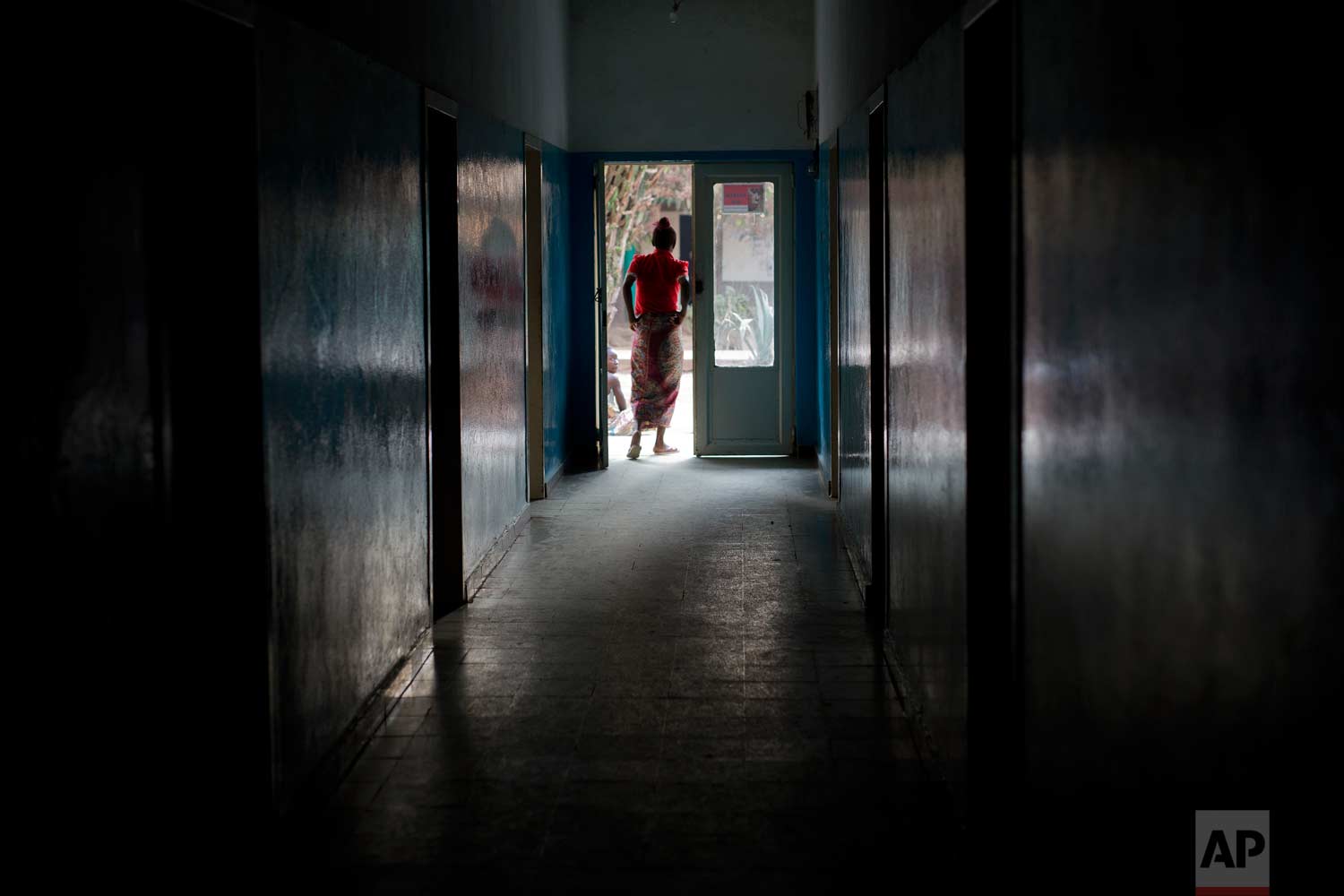  A patient stands in a doorway at the Katuba Reference Hospital in Lubumbashi, Democratic Republic of the Congo on Monday, Aug. 13, 2018. (AP Photo/Jerome Delay) 