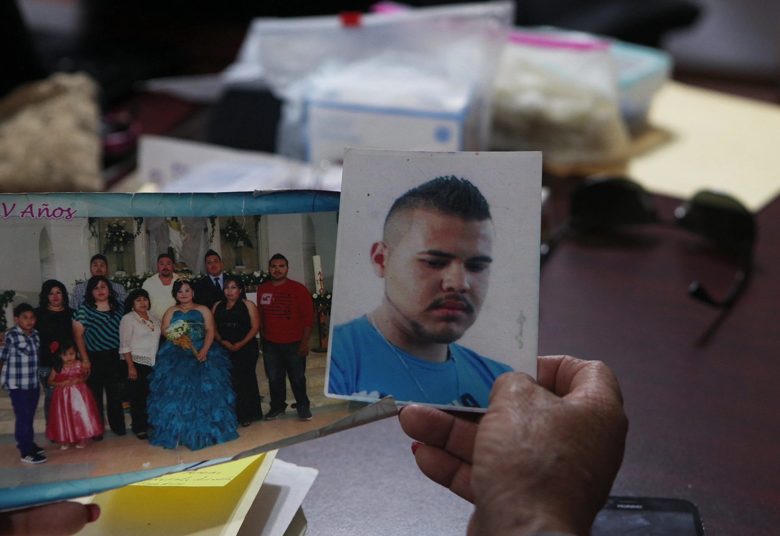 In this Thursday, March 22, 2018 photo, a photo of Armando Reyes, who disappeared in 2016, is displayed at a human rights commission in Chihuahua, Mexico. (AP Photo/Marco Ugarte)