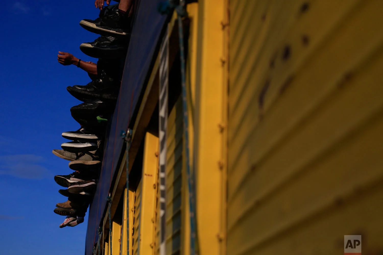 Migrants ride on a truck near Tapanatepec, Mexico, Monday, Oct. 29, 2018. Thousands of migrants traveling together for safety resumed their journey to the U.S. border after taking a rest day Sunday in Tapanatepec, while hundreds more migrants were pushing for entry to Mexico. (AP Photo/Rebecca Blackwell)