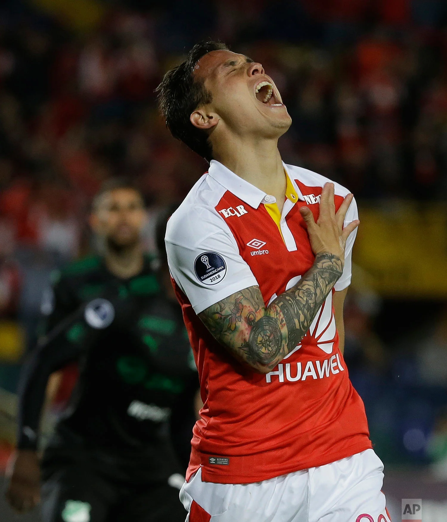 Luis Seijas of Colombia's Independiente Santa Fe reacts after missing a chance to score during a Copa Sudamericana soccer match against Deportivo Cali in Bogota, Colombia, Oct. 23, 2018. (AP Photo/Fernando Vergara)