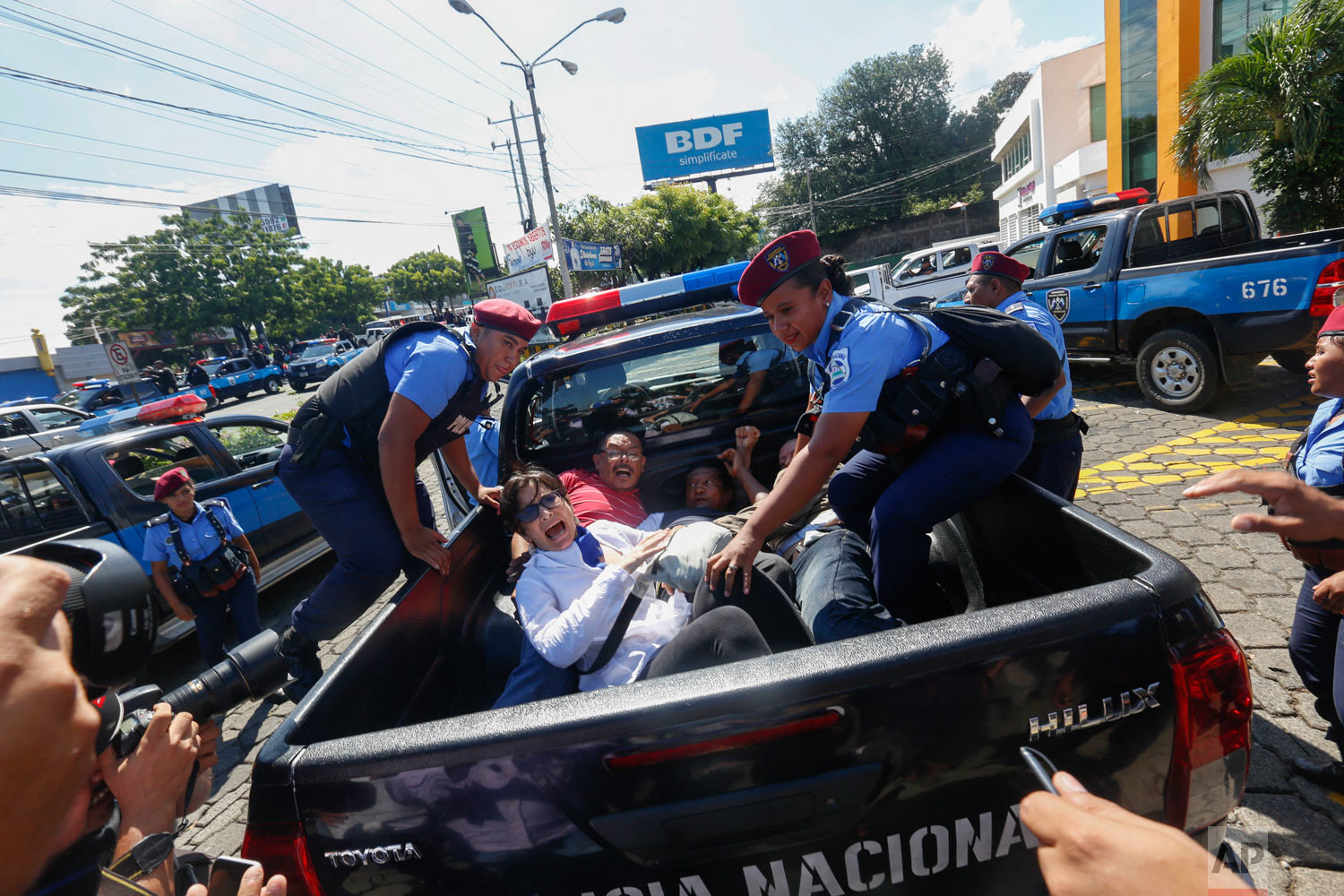  Anti-government protesters are arrested and taken away by police as security forces disrupt their march, coined "United for Freedom," in Managua, Nicaragua, Oct. 14, 2018. Anti-government protests calling for President Daniel Ortega's resignation ar