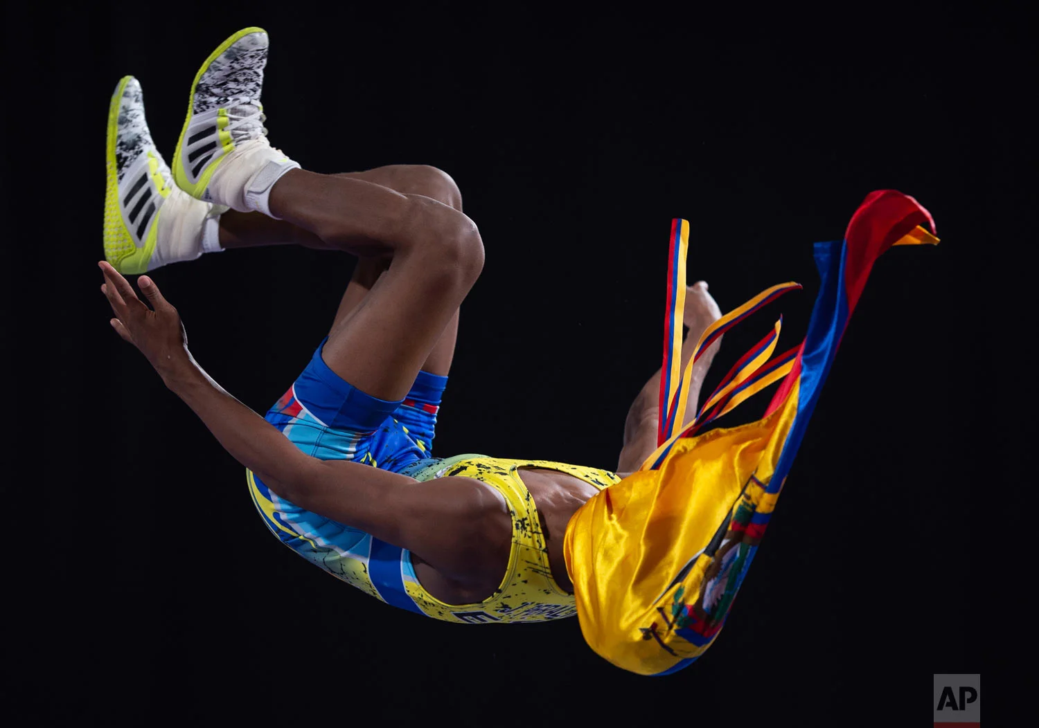 In this photo provided by the OIS/IOC, Ecuador's Jeremy Renzo Peralta Gonzalez celebrates his silver medal win during the men's Greco-Roman 45kg wrestling event during the Youth Olympic Games in Buenos Aires, Argentina, Oct. 12, 2018. (Florian Eisele/OIS/IOC via AP)