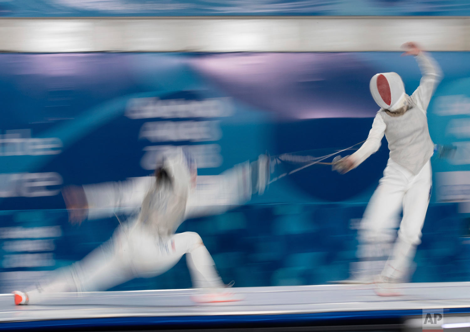  In this photo provided by the OIS/IOC, USA's May Tieu, left, and France's Venissia Thepaut compete in a mixed continental fencing team match during the Youth Olympic Summer Games in Buenos Aires, Argentina, Oct. 10, 2018. (Ian Walton /OIS/IOC via AP