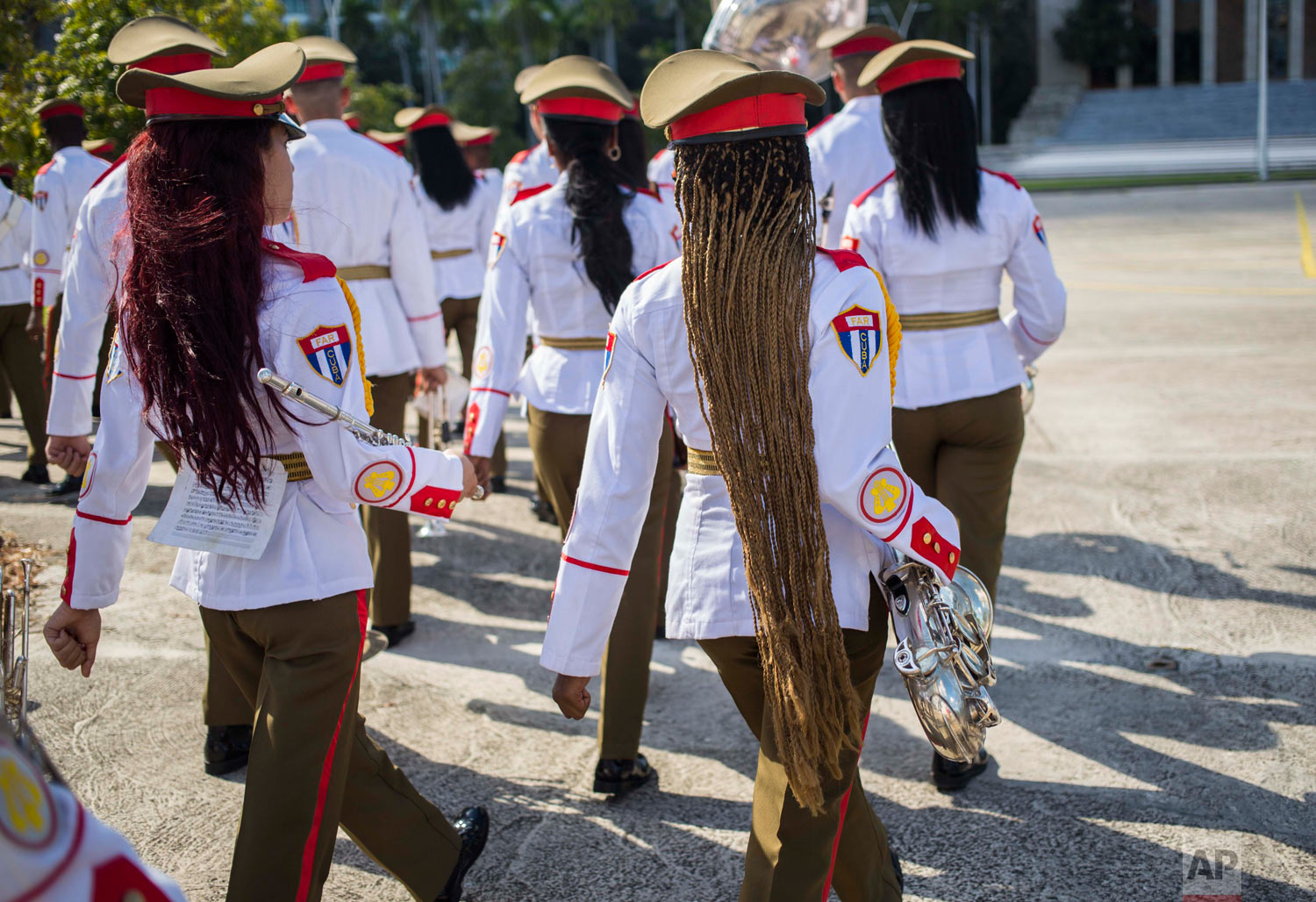  The honor guard military band marches after the arrival of El Salvador's President Salvador Sanchez Ceren at Revolution Square in Havana, Cuba, Oct. 25, 2018. (AP Photo/Desmond Boylan) 