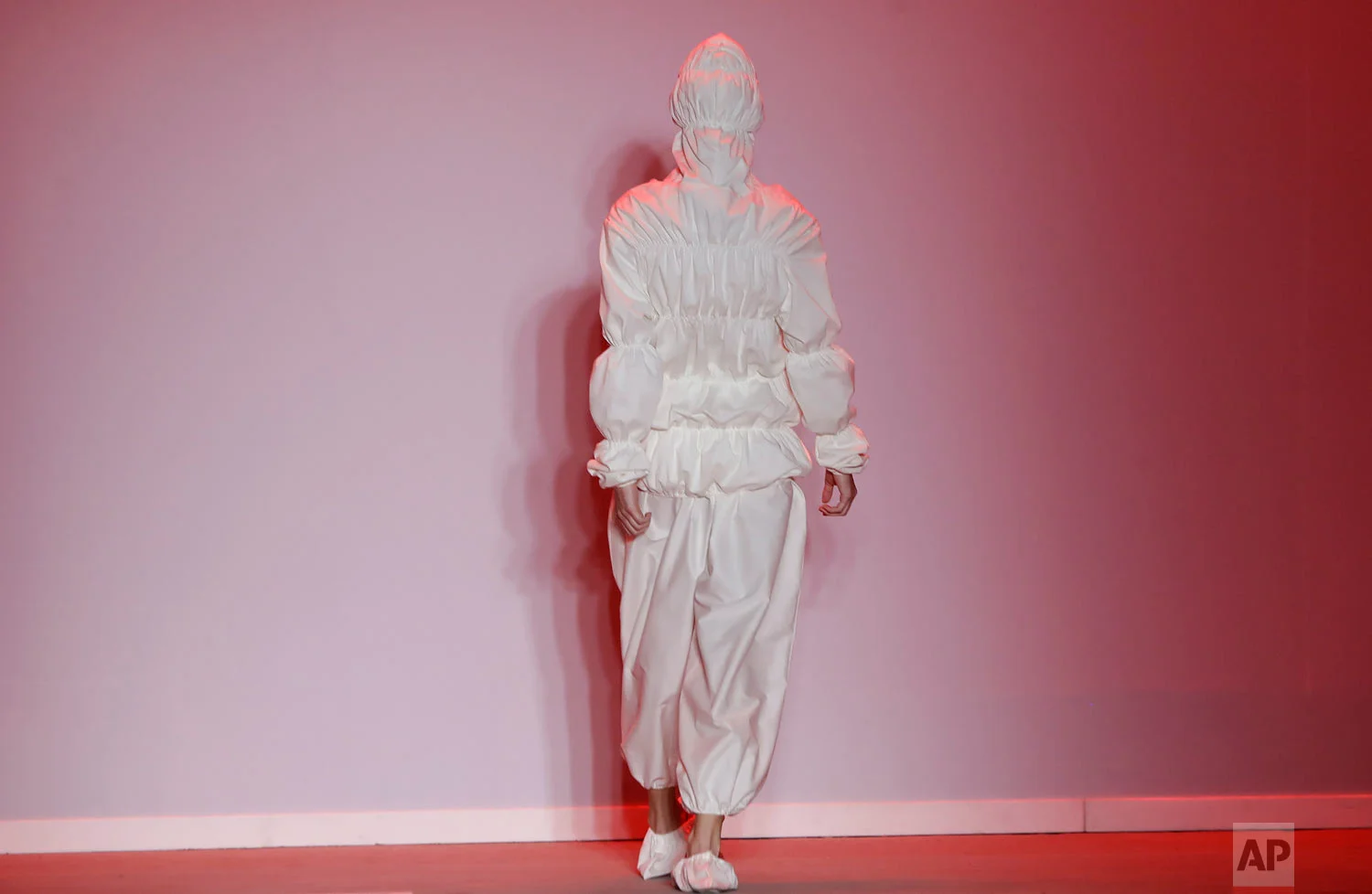 A model wears a creation from the Ao collection, which is part of the Estufa project, during Sao Paulo Fashion Week in Sao Paulo, Brazil, Oct. 24, 2018. (AP Photo/Andre Penner)