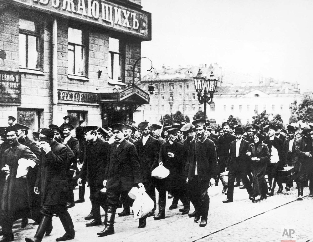  In this Aug. 8, 1914 photo, Russian reservists walk with their belongings in St. Petersburg, Russia. Russia entered World War One with an army which was massive but badly armed. (AP Photo) 