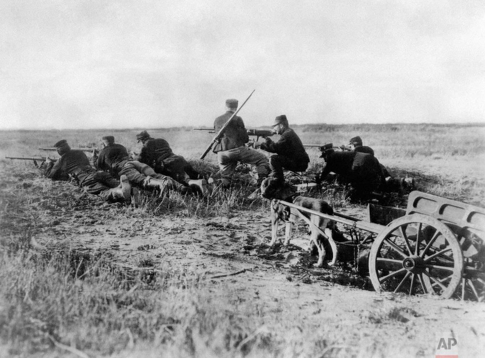  In this Aug. 1914 photo, a Belgian machine gun detachment sets up near Haelen, Belgium. The Belgians often used dogs to draw the ammunitions cart. The Battle of Haelen was also known as the Battle of the Silver Helmets. (AP Photo)

 