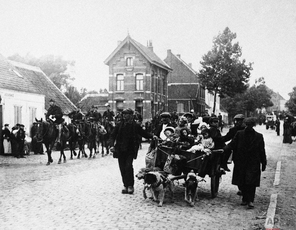  In this Oct. 14, 1914 photo, Belgian civilians and a cavalry detail move out of the pathway of the German advance during World War One in Antwerp, Belgium. (AP Photo) 