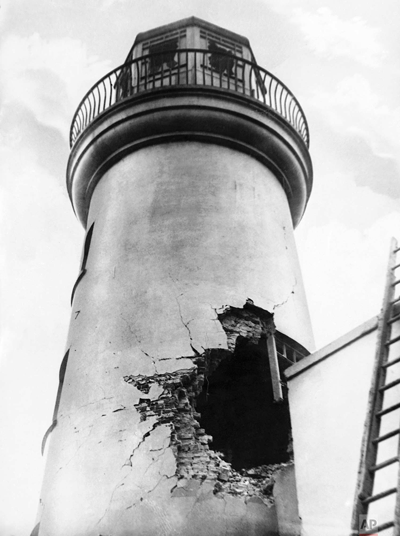  In this Dec. 1914 photo, damage from German bombardment to the lighthouse in Scarborough, England during World War One. (AP Photo) 