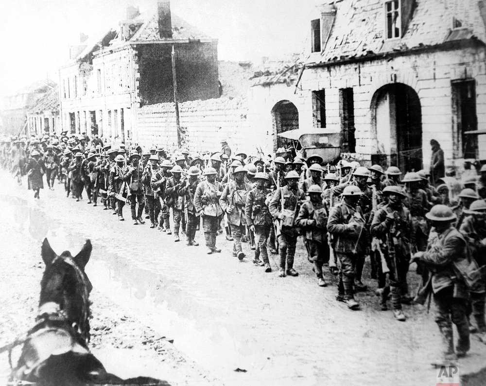  In this 1917 photo, British World War One soldiers return in formation to Ypres, Belgium. (AP Photo) 