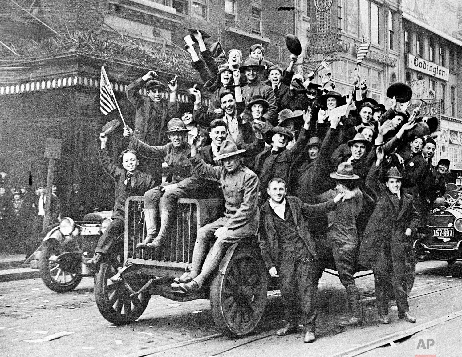 Celebrants cheer along Broadway near New York’s Times Square as news of the armistice spreads on Nov. 11, 1918. (AP Photo)