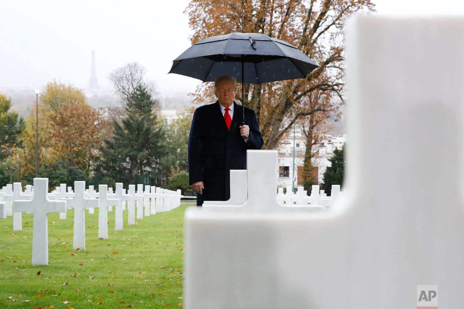 President Donald Trump stands amongst the headstones during an American Commemoration Ceremony Nov. 11, 2018, at Suresnes American Cemetery near Paris. (AP Photo/Jacquelyn Martin)